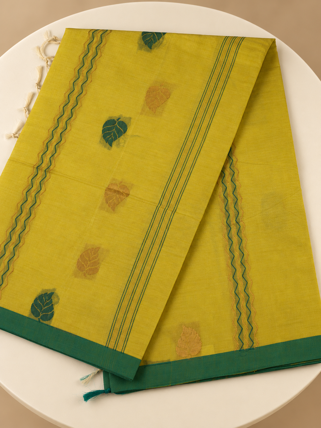 Harita Patra - A fresh leaf on yellow.