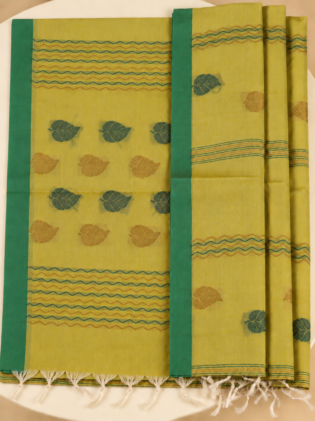 Harita Patra - A fresh leaf on yellow.