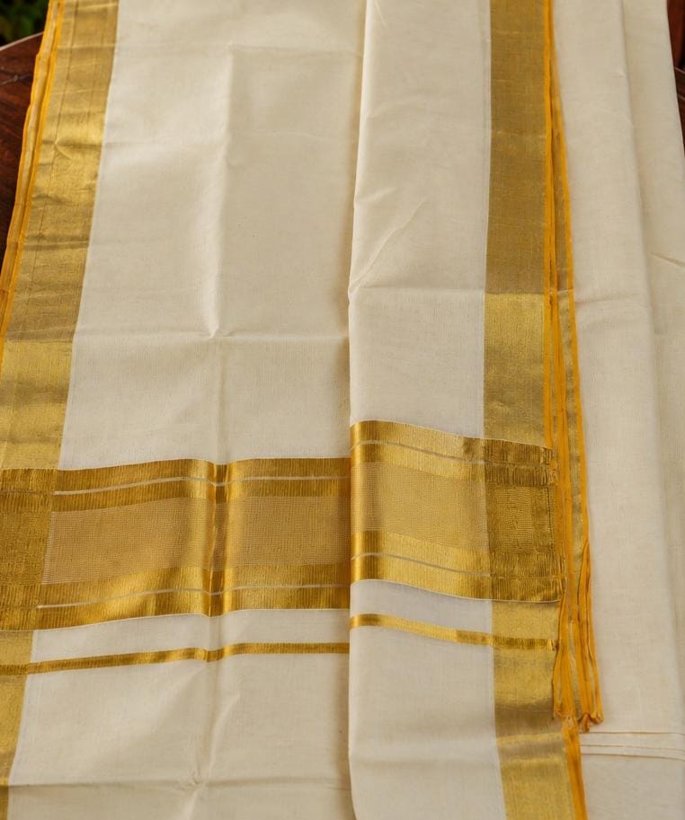 Suvarna - Grace isn't always adorned. Sometimes, it's simply woven in ivory and gold.