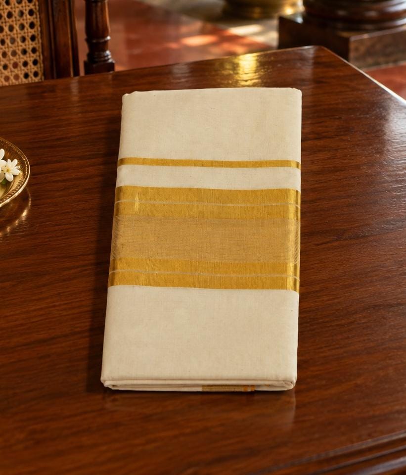 Suvarna - Grace isn't always adorned. Sometimes, it's simply woven in ivory and gold.