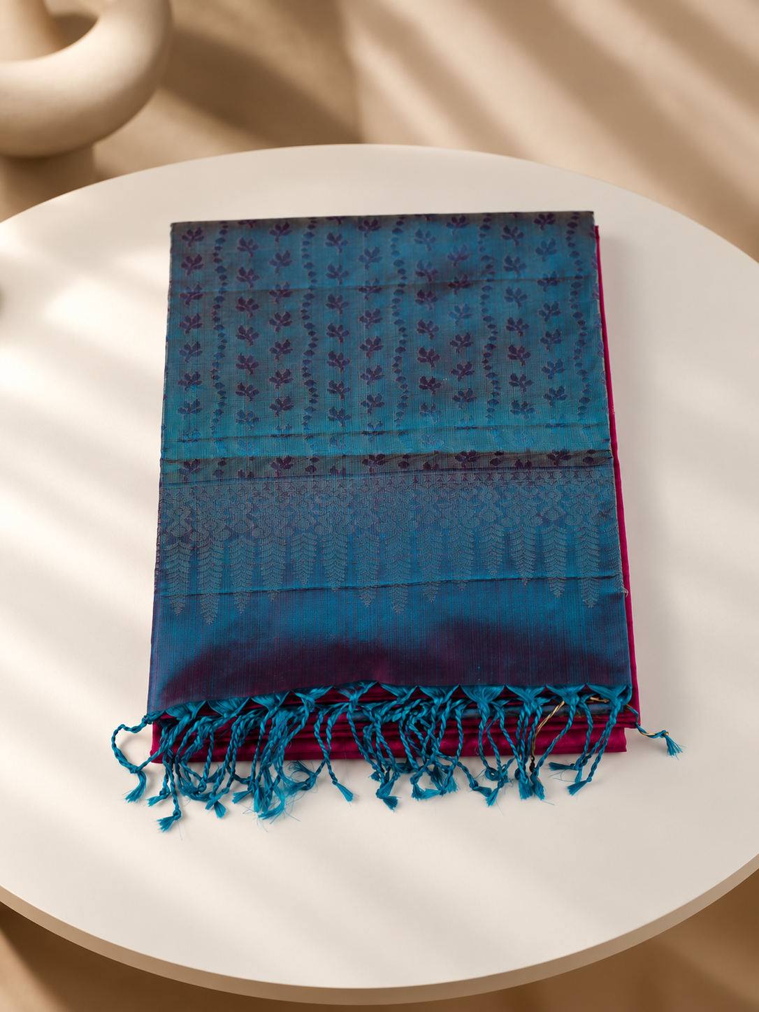 Neelatarang - A vivid play of pink and peacock teal.
