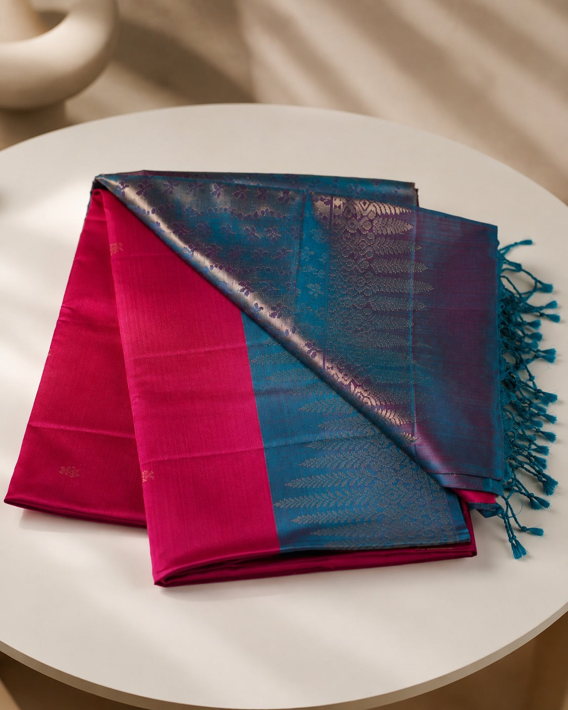 Neelatarang - A vivid play of pink and peacock teal.