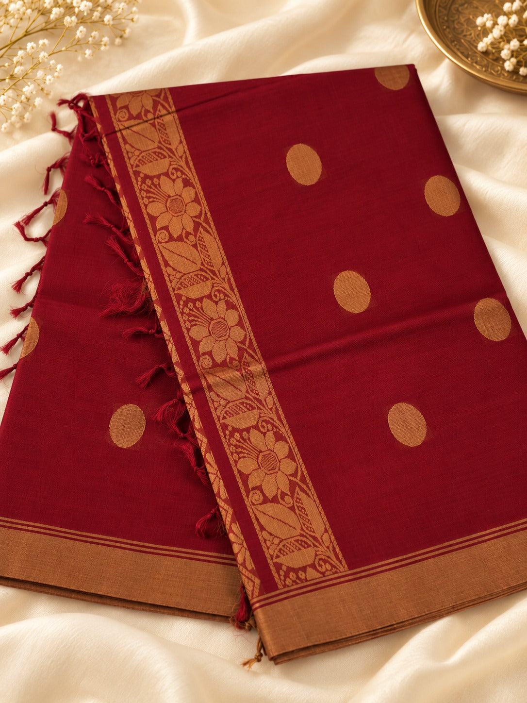 Sindoor Pushpa - A timeless bloom in sindoor & gold.