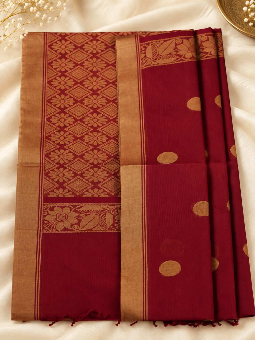 Sindoor Pushpa - A timeless bloom in sindoor & gold.